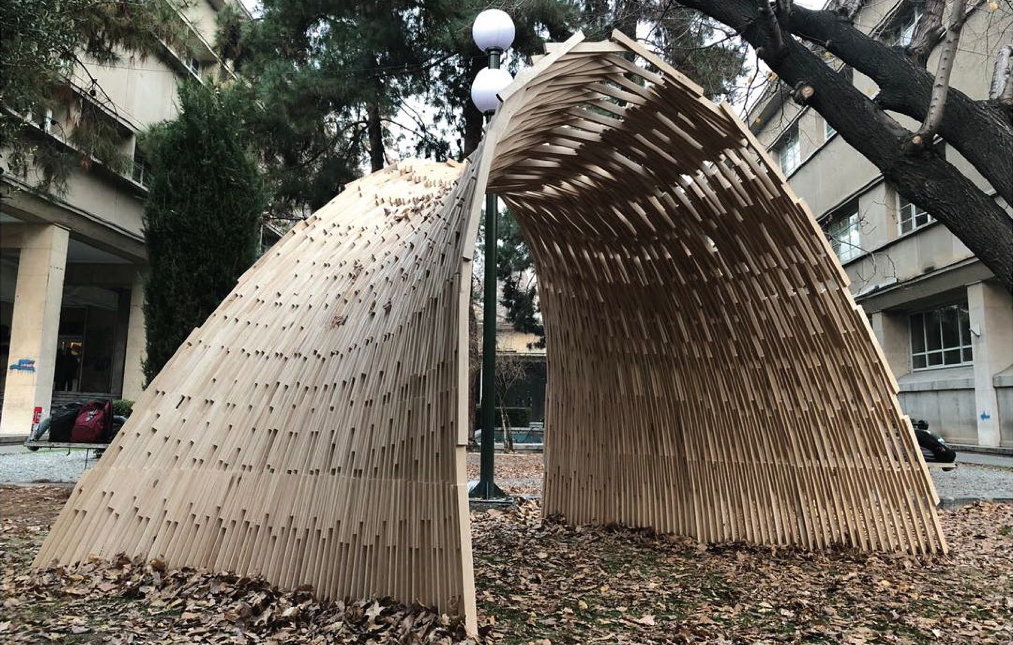 Completed plywood pavilion fabricated through a robotic pick-and-place workflow